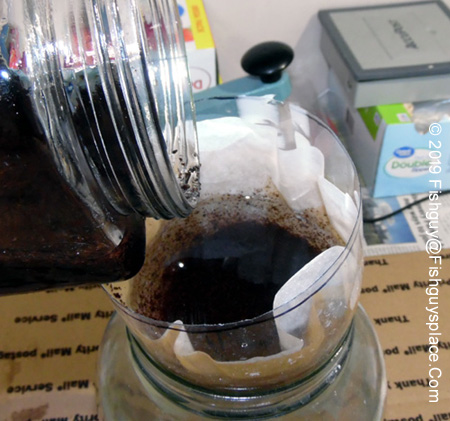 pouring coir into the funnel